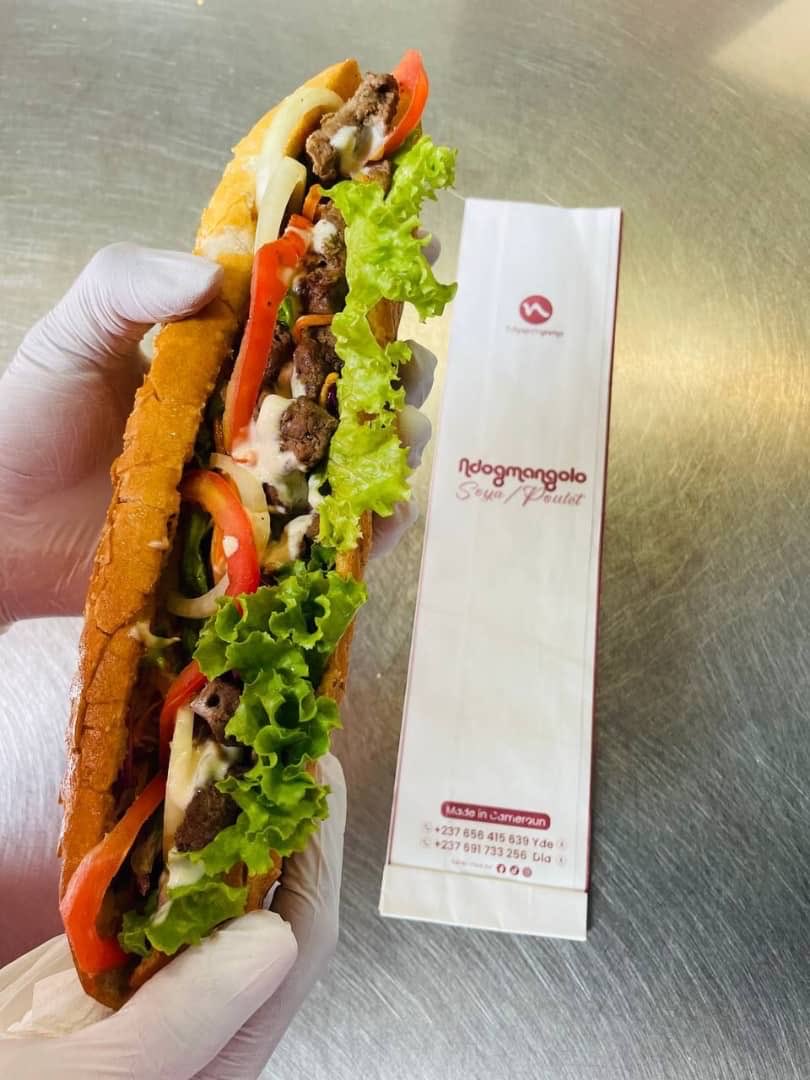 🥖✨ NDOGMANGOLO ✨💖
👉 Le meilleur sandwich du pays 😎🔥

Tu as 2500frs et tu veux bien manger ?
Notre Ndogmangolo ne peut pas te décevoir 😋
🥖 Pain croustillant
🧀 Fromage fondant
🥬 Laitue fraîche
🥕 Crudités savoureuses
🍗 Poulet ou  Soya
🤫 Sans oublier la sauce secrète