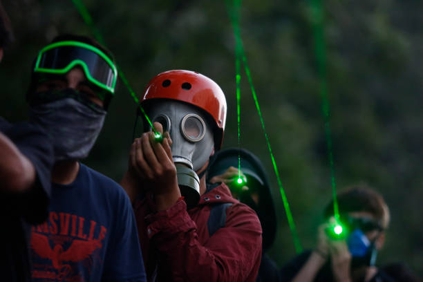 Uso coordinado de punteros láser para cegar a Carabineros durante el intento golpista de 2019. En ese contexto, el Congreso acordó un plebiscito constitucional.