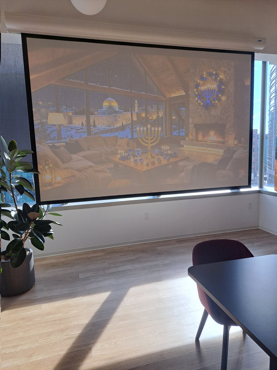 I'm fried why is there an AI generated cozy cabin background of ISRAEL in my office