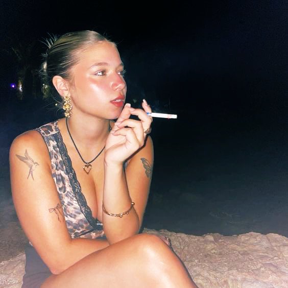 Smoke curls.
Time stalls.
Night leans closer.