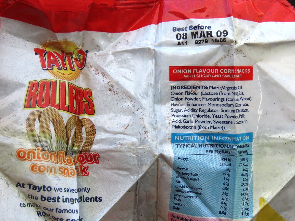 _Stickybeak's tweet photo. More bits of long-lived litter from a #2minutebeachclean - a discarded crisp packet folded into a triangle turned out to be Tayto Rollers from 2009. Also old-style Asda Smart Price packaging  that dates to some time between 2004 and 2012  #WashedUpOnRathlin #vintagelitter https://t.co/HsIuDMHqi7