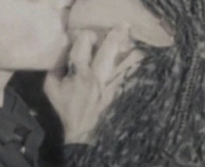 GRIPPING her face like goddamn