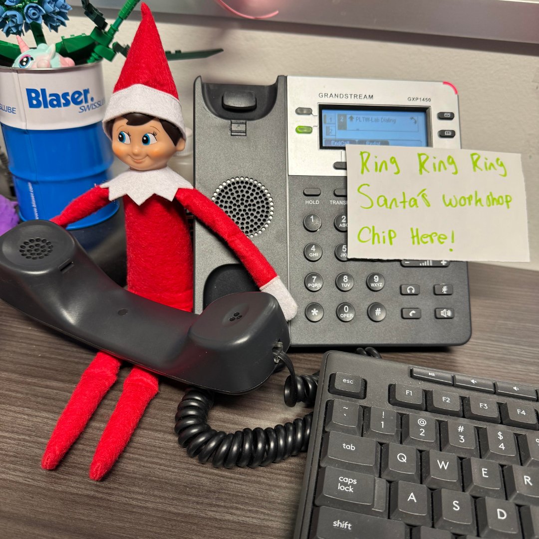 It appears that Chip, our helpful elf, is currently taking a call from Santa's workshop. He's always ready to assist with any requests or inquiries.