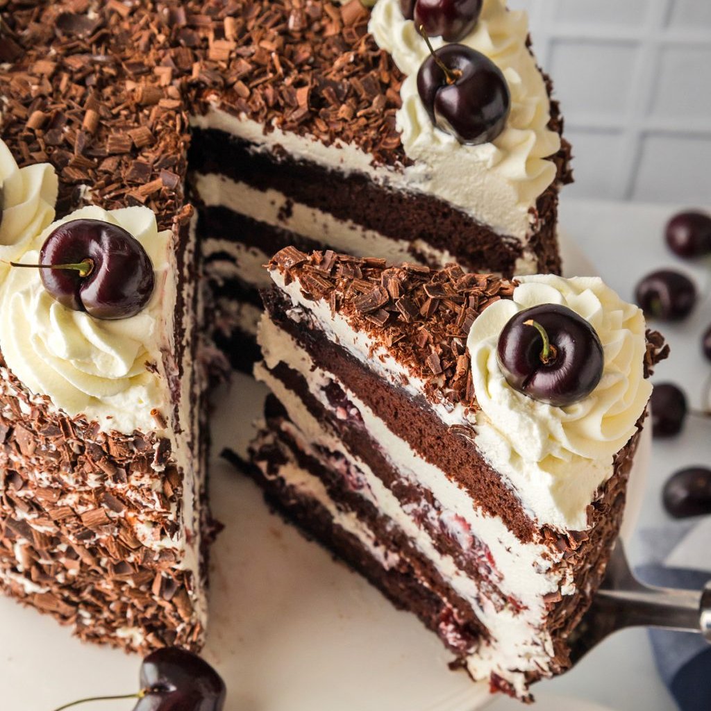 Classic Black Forest Cake with chocolate layers, cherry filling, and whipped cream inspired by my Grandma’s holiday dessert table. #blackforestcake #layercake #cake #chocolatecake #cherries #dessert #Christmas #holidays melissassouthernstylekitchen.com/black-forest-c…