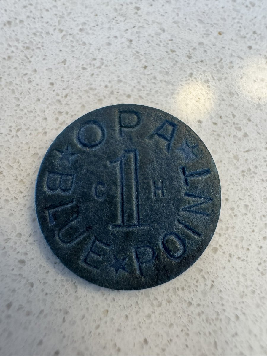For anyone who has never seen one this is an OPA (Office of Price Administration) ration token from WW2.  Blue were for processed foods and red were for meats/fats.