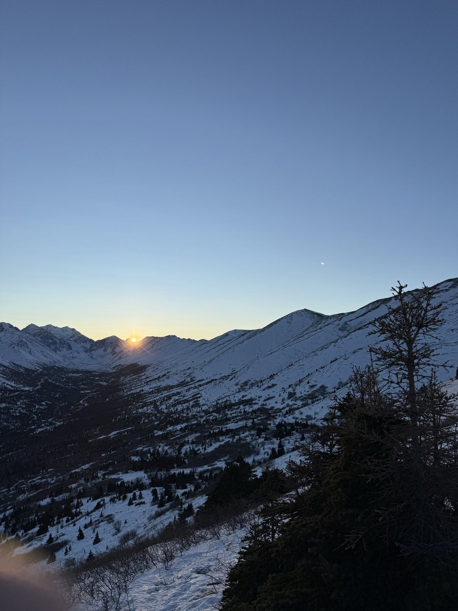 OuthereinAlaska's tweet photo. Sun creeping over the mtns at 11am. #winter #WinterSolstice https://t.co/nkXHgAiPid