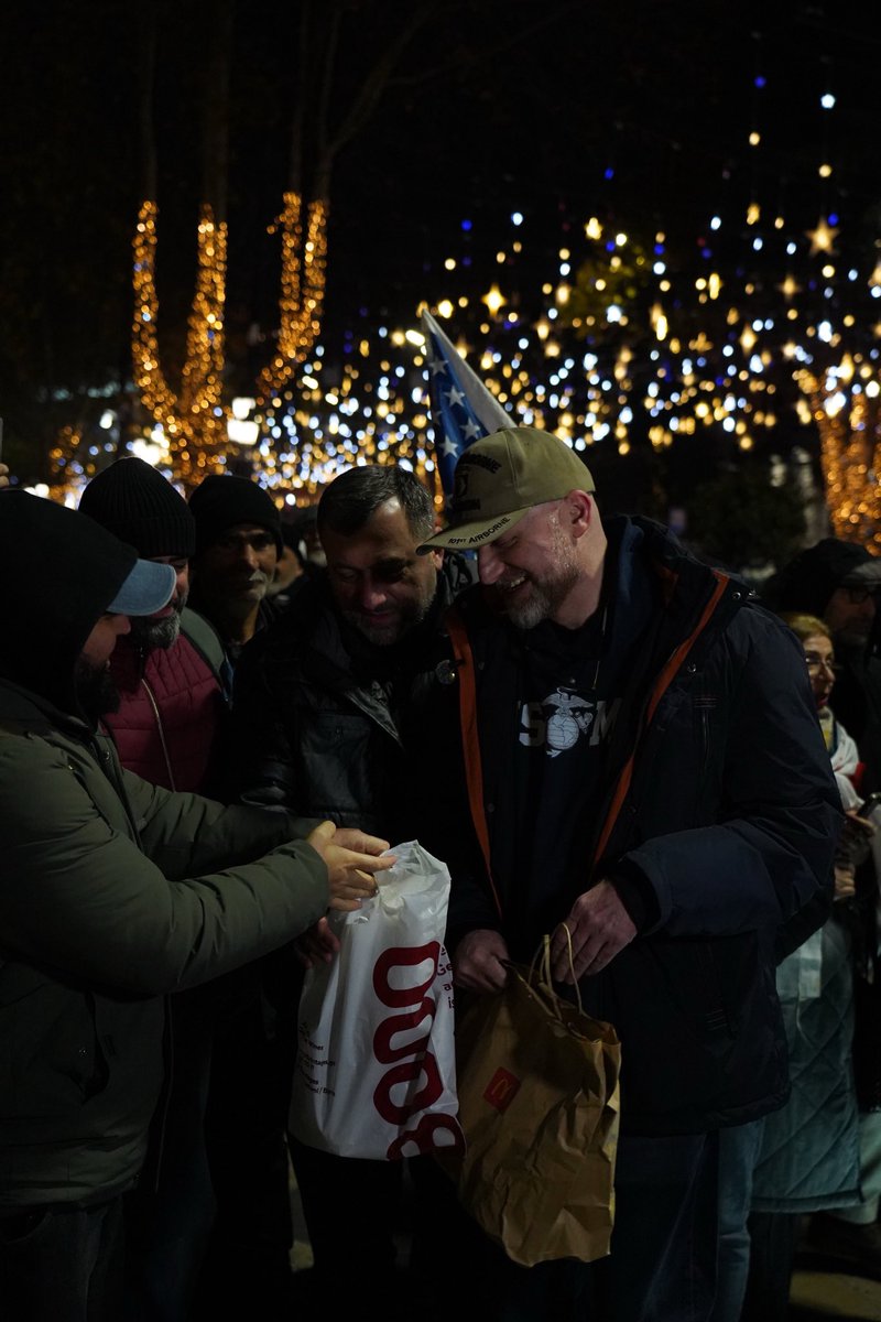 GIRCHIMF's tweet photo. Political leader Zurab Japaridze @Zuraja spent his first evening out of prison on Rustaveli Avenue at the protest. People greeted him with hugs and with the food he had missed most: McDonald’s. https://t.co/HHxOiefYVu