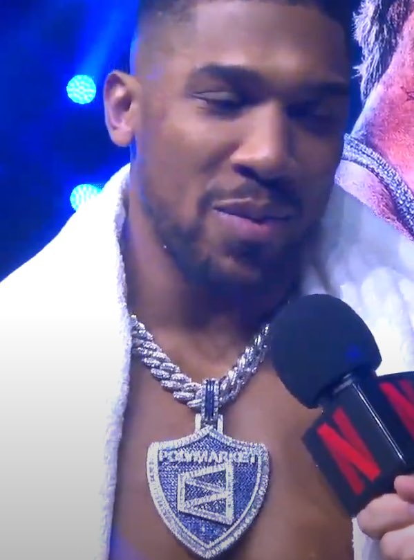__Talley__'s tweet photo. Just watched Jake Paul get knocked out by Anthony Joshua who was wearing a Polymarket chain the size of Texas around his neck.

What reality are we living in? https://t.co/UzNSS39QlC