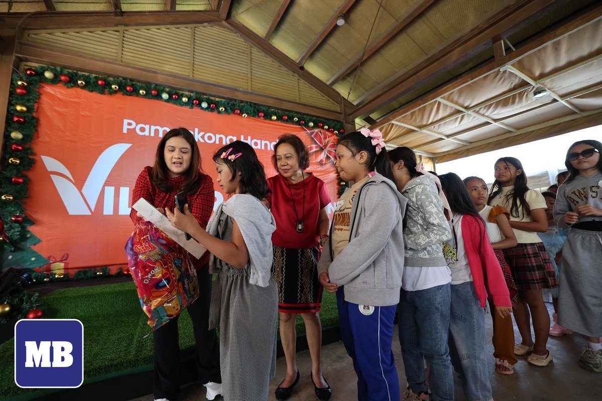 LOOK: Senator Camille Villar, along with her 10-year-old son Tristan and her mother, former Senator Cynthia Villar, distributes gifts to children from the Baseco, Tondo community during a gift-giving activity at the Villar Children’s Farm in Bacoor, Cavite, on Saturday, December