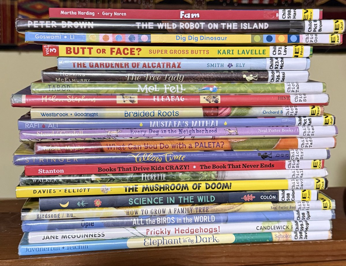 LouiseMAamodt's tweet image. Time for another exciting rendition of #Library #Book return pile. #BookNerd