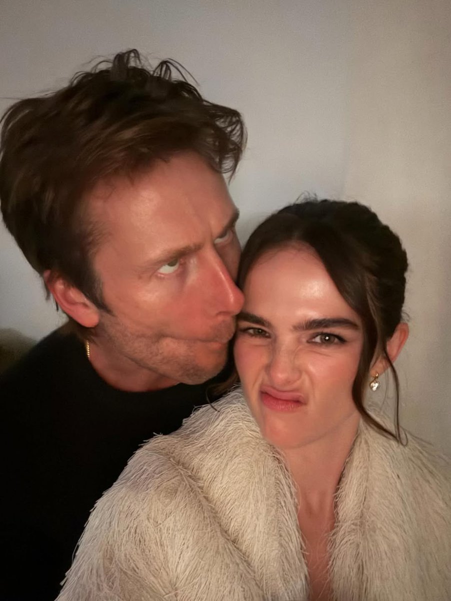 Glen Powell and Zoey Deutch at her holiday soirée 2025.