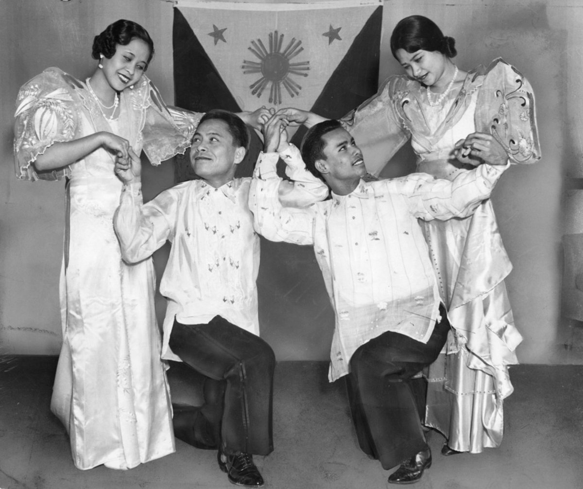 Filipino college students in traditional attire celebrating the inauguration of the Philippine commonwealth, November 16, 1935. University of Chicago.

Left to right: Mrs. Pompeia Ponce, Santa Romania, Alfredo Marat, and Mrs. Mercedes Guinsatao.