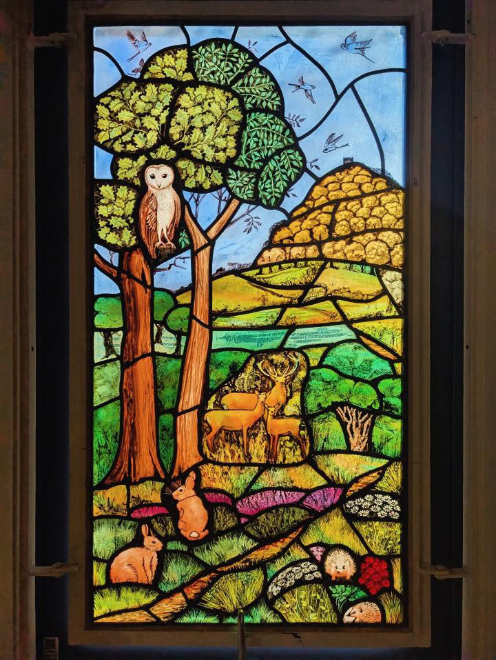 On the shortest day, have cheer - the light will return!  This photo was given to me a few days ago by my friend Clare Nettleton.  It shows winter sun lighting up the window I made for Grace’s Room, at Williton Hospital, Somerset.  It is of Exmoor …