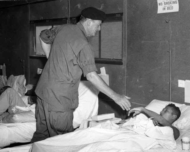 Vietnam
John Wayne's Compassion

The hospital ward was quiet when John Wayne stepped into the room. In one corner, a soldier lay with his face turned to the wall. The bandages had just come off, and he refused to face a mirror. The Duke pulled up a chair and sat down and didn't