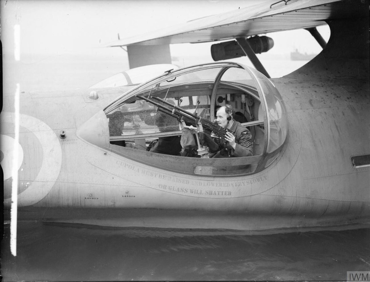 An air gunner demonstrates handling a pair of .303 Browning machine guns, mounted in one of the blister gun-turrets of a Consolidated Catalina of No. 4 (Coastal) Operational Training Unit on Loch Ryan, Ayrshire.

Image: IWM (CH 2449)