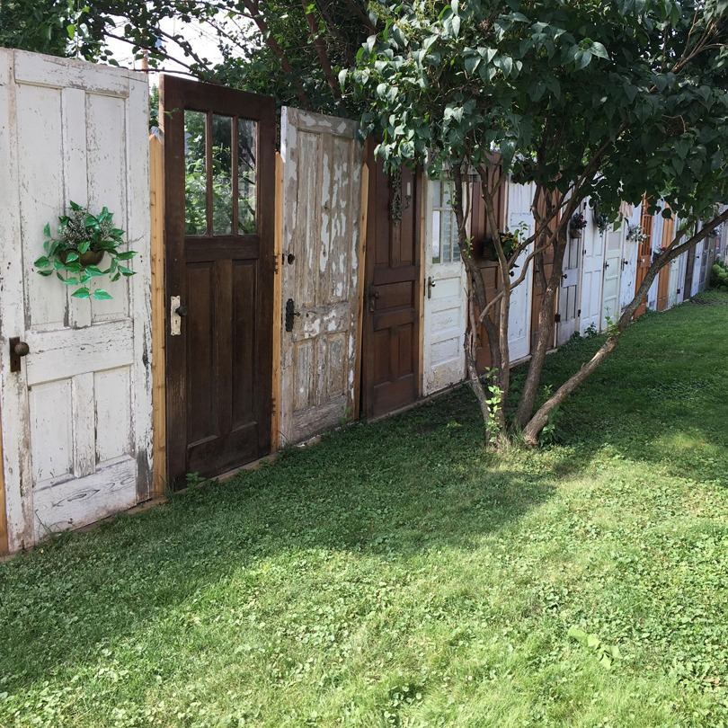 BiancoDavinci's tweet image. Fence made from random doors.