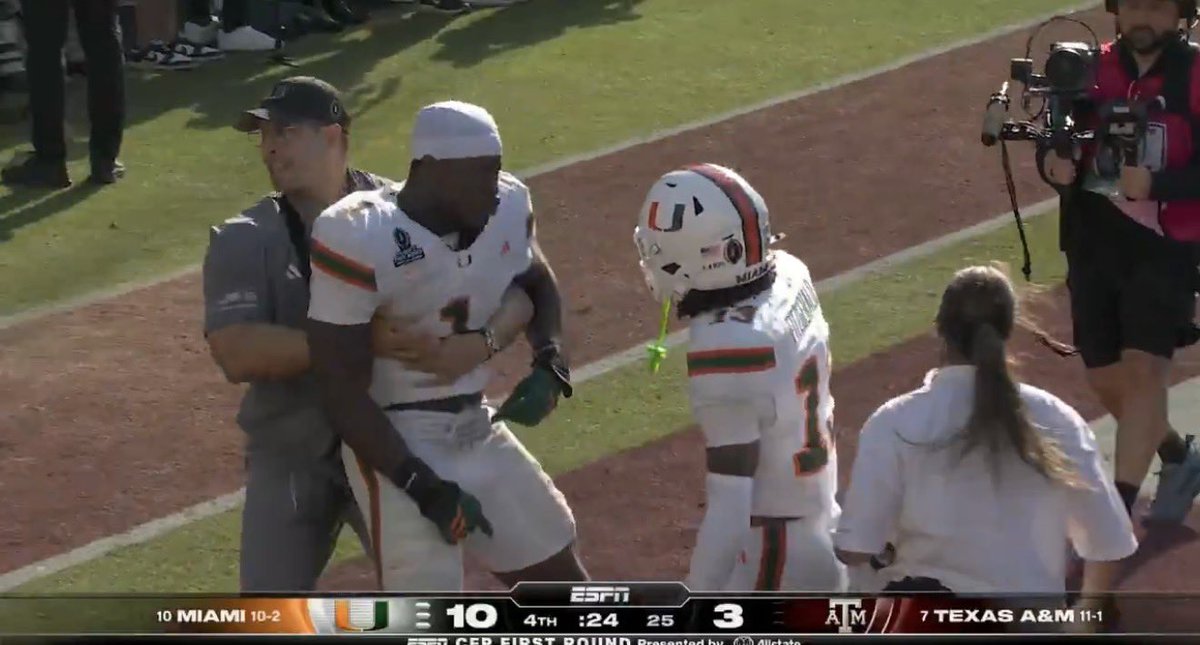 Smith31Kev's tweet image. Mo Toure literally being held back by medical staff after making a game changing play so he can celebrate with his guys is the mentality we’ve been missing in this program. A DAWG.