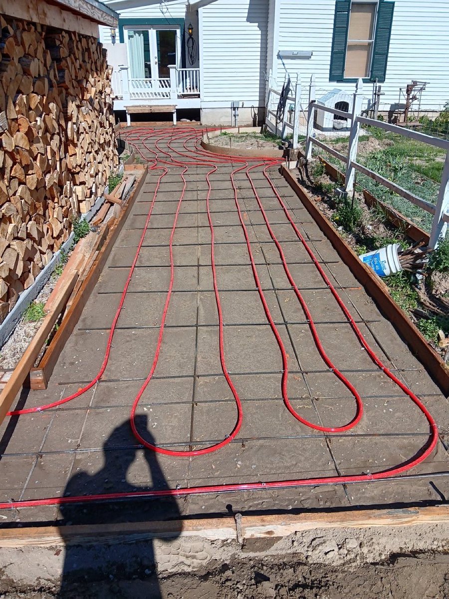 DocumentingBTC's tweet photo. This Bitcoin mining snow melt system uses waste heat of the computers to warm a concrete walkway via a hydronic loop. Here, a 3 kW S19 Pro 110T runs in a FogHashing C1 immersion tank, heating fluid that melts snow and keeps a garage warm, nearly silent. https://t.co/lVPMfTWOXl