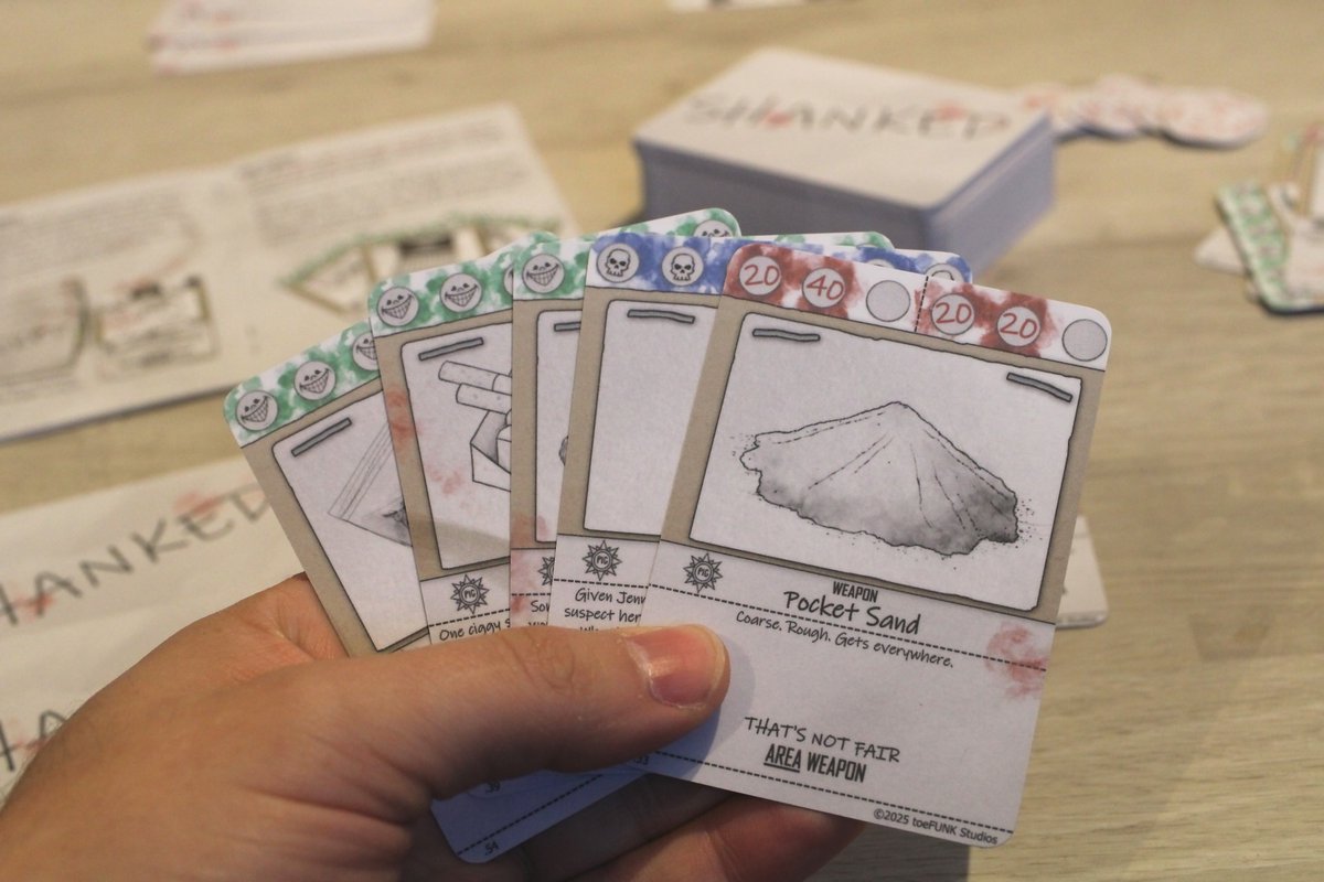 toeFUNKstudios's tweet image. COMING 2026!!!  

Here are our product shots for our upcoming handmade card game Shanked 

It's a heartwarming game about prison brawls, Class-A drugs and nudey pictures, where only the top dog survives.  #tabletopgaming #gaming