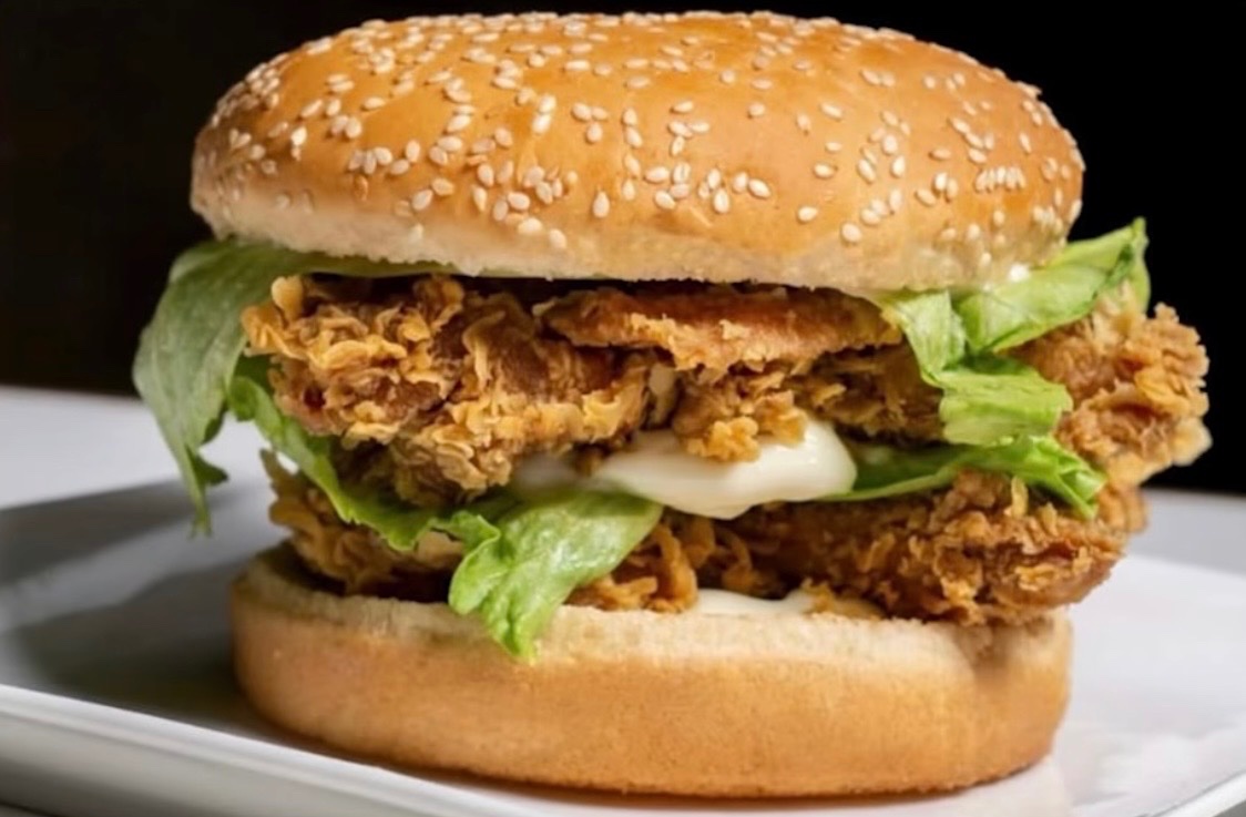 A man crafted a chicken sandwich completely from scratch. He grew the vegetables, flew to collect ocean water for salt, milked a cow for butter and cheese, processed a chicken for meat, and harvested wheat for flour. The six-month project cost about $1,500.
