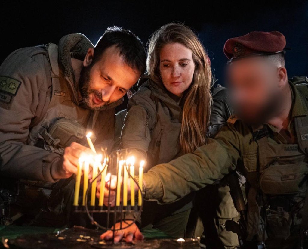 Broide's tweet image. *IDF Lights Hanukkah Candles in Rafah With Bibas Family Menorah as Fallen Sister’s Message of Defiance Echoes Through Gaza*

On the final night of Hanukkah, the IDF says soldiers lit the eighth candle in Rafah with Sgt. (res.) Dana Silberman-Sitton Bibas, the sister of Shiri…