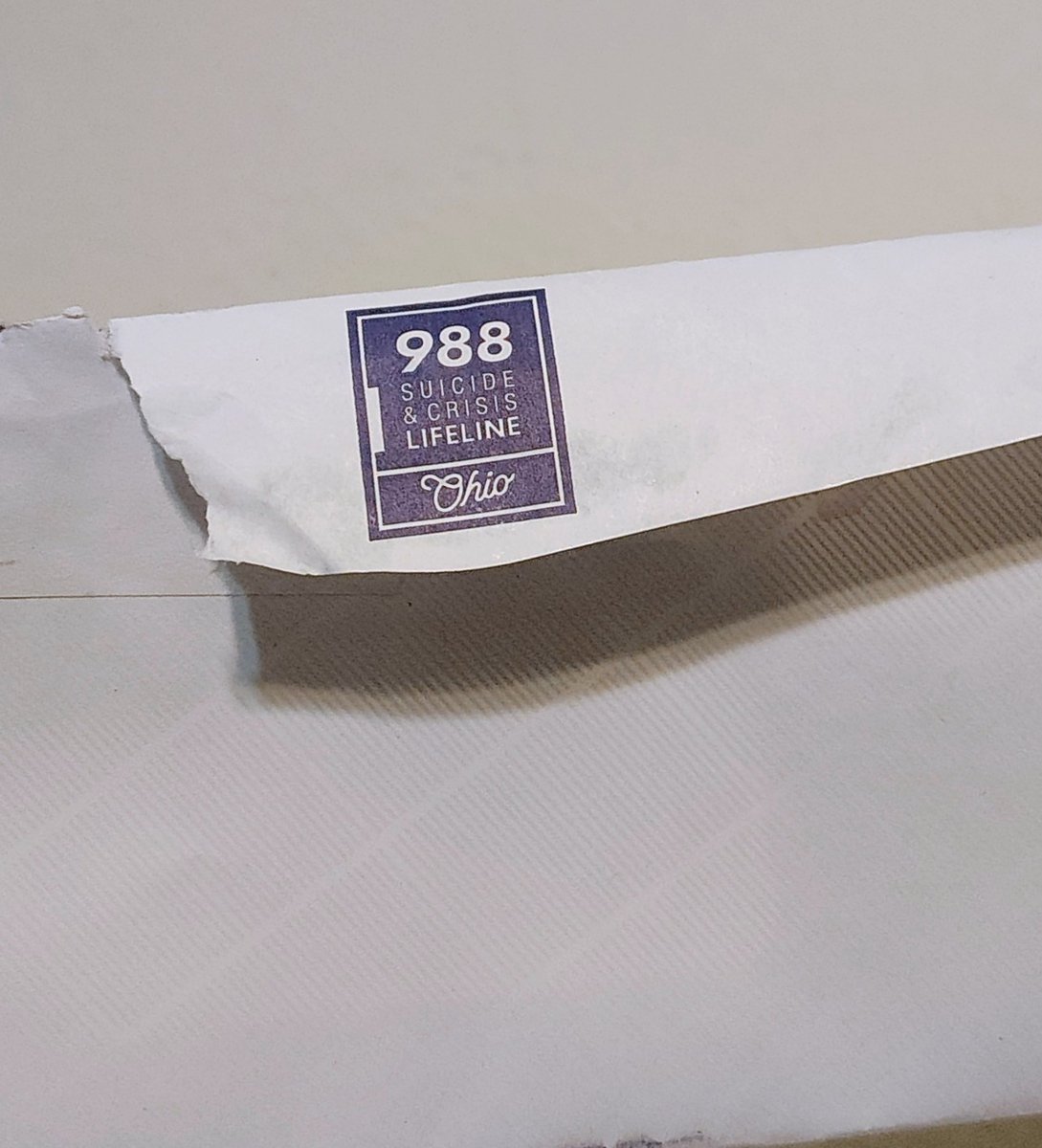 talyaTheeEnby's tweet image. My SNAP denial came with the 988 suicide hotline on the envelope and a smiley face inside. This is what “support” looks like under austerity: crisis lines instead of material care.
