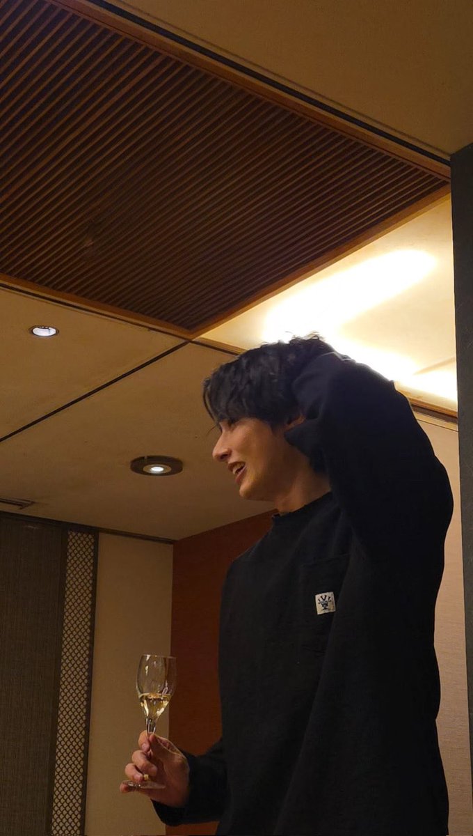 diorjww's tweet image. it's literally just jun holding a glass of wine, getting shy while making a toast for the first time since their debut, and yet somehow i'm completely obsessed