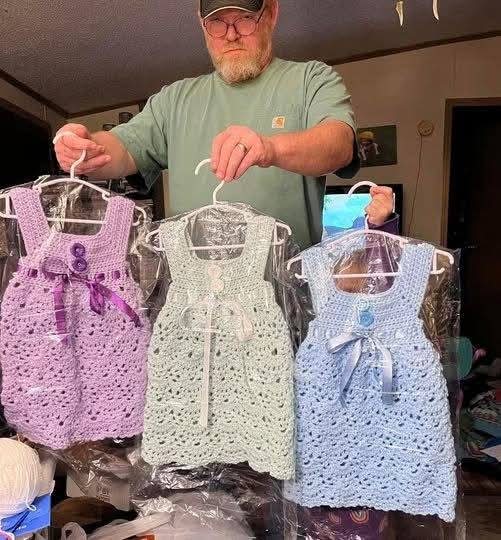 CrazyVibes_1's tweet image. My husband of 32 years just sent me this photo from his workshop, three tiny crochet dresses hanging on those little plastic hangers, and I'm sitting here in the Walmart parking lot crying into my steering wheel like a crazy person.
For months, I watched him sneak yarn into the…