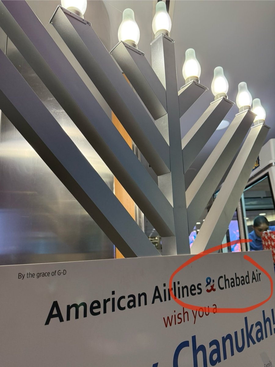 Broide's tweet image. I’ve been a longtime fan of American Airlines.
Miles. Routes. The occasional upgrade.

But today I noticed something I never expected to see at JFK:
American Airlines &amp;amp; Chabad Air.

Chabad Air.
I don’t know when I signed up for that loyalty program, but apparently it comes with…