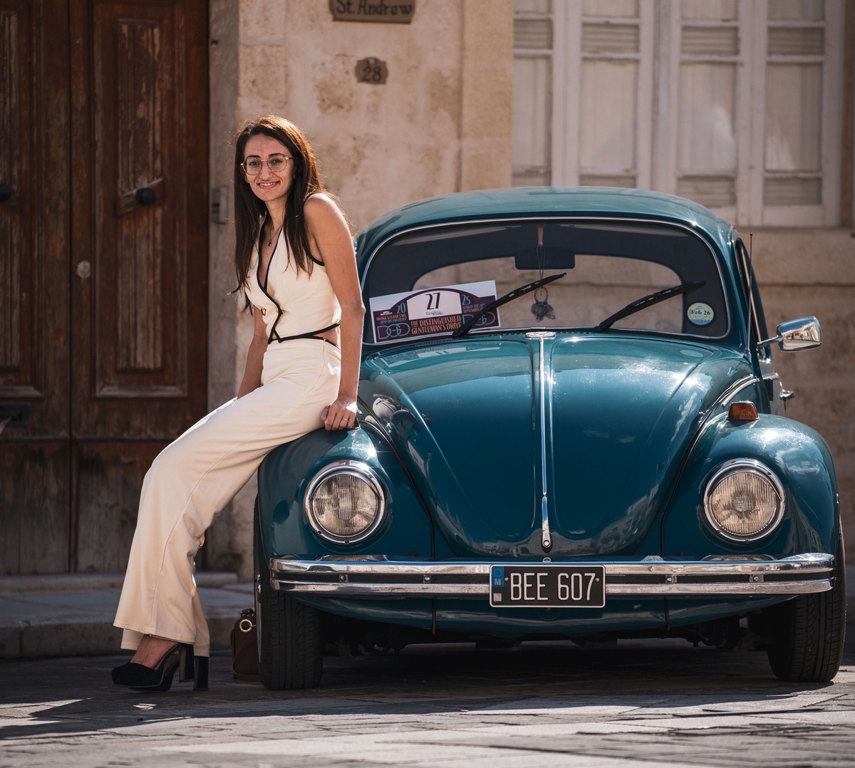 Cream-clad and cool, perched on a teal Beetle that knows its way around Malta’s cobblestones. The perfect excuse to dust off your own dapper digs and roll in next September.  

📸 @rottamedia  
🌎 Malta