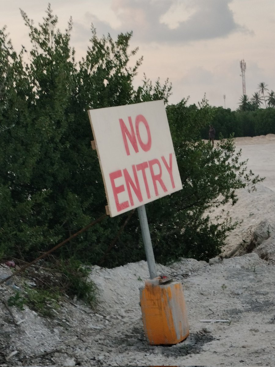 A mangrove’s silence speaks volumes. 
Once a cradle of life, now marked with a bold red warning: NO ENTRY. 
Dredged. Reclaimed. Restricted. 
But who gave permission to silence the tides, to erase the roots that held our shores together? #Environment #adducity #fishimathi