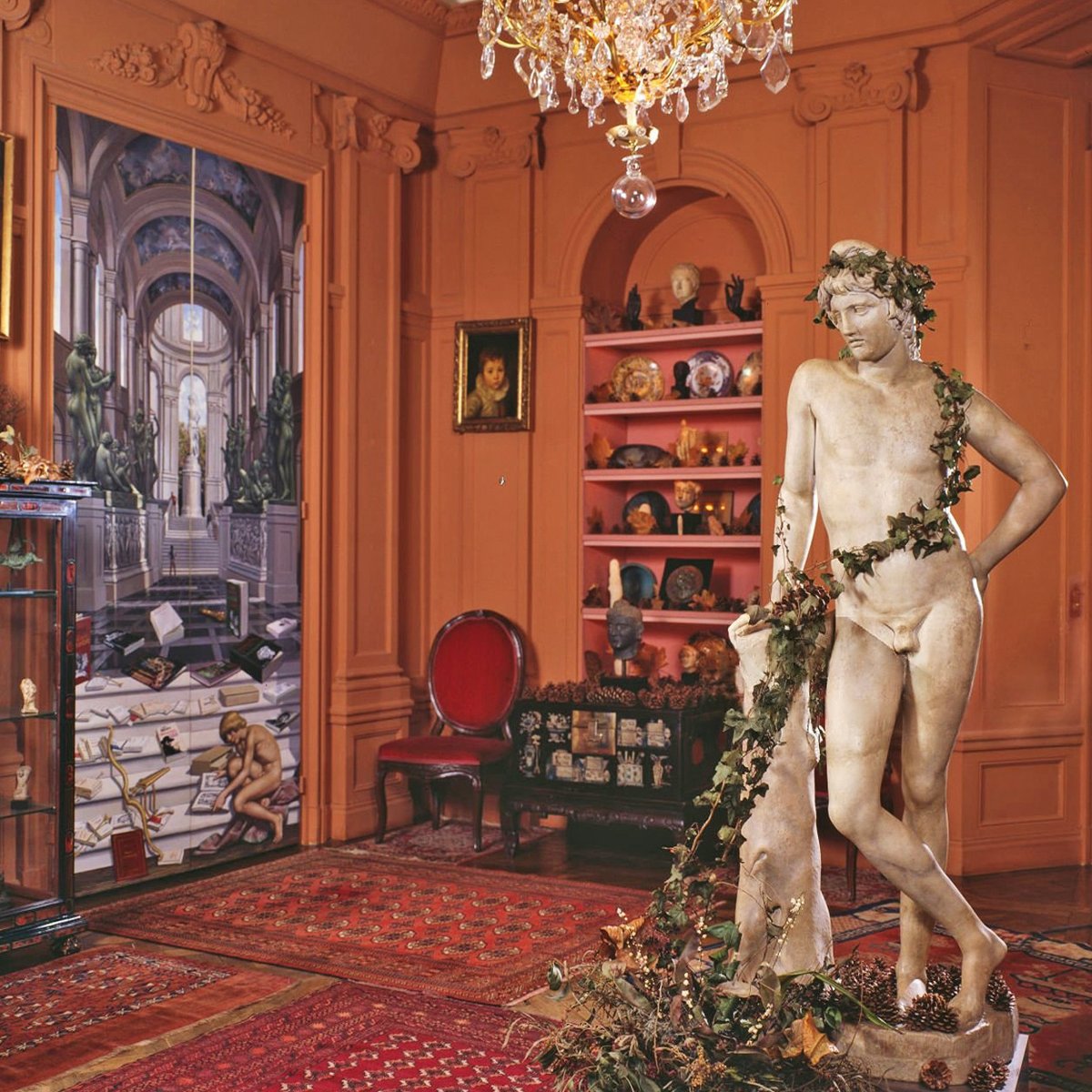 A corner of Roger Peyrefitti's apartment opposite the Bois de Boulogne. The plethora of pinecones on the cabinet, under the statue and elsewhere was more than décor. Each was the memento of a youthful orgasm sourced in the Bois. That's warm friendly France for you.