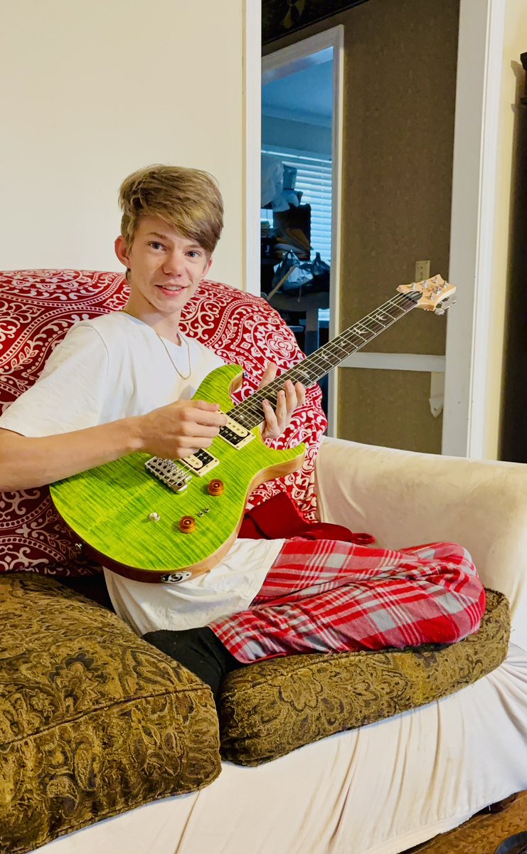KickEthanKick's tweet photo. Ethan getting his surprise from Santa! He is so hard to surprise! Santa got him!! #prs #guitar #music #electricgreen https://t.co/iGQnaXCjuS