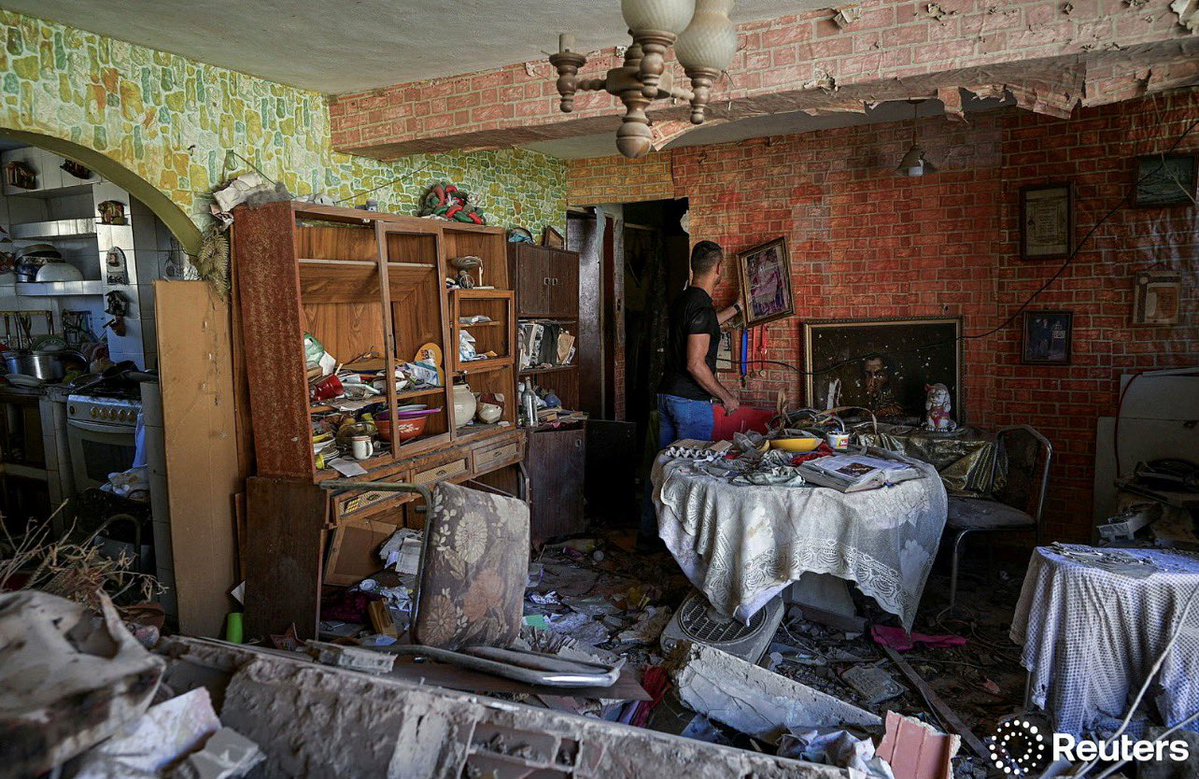 Jesus Linares, 48, stands at his damaged apartment, after the U.S. launched a strike on Venezuela, capturing its President Nicolas Maduro and his wife Cilia Flores, in Catia La Mar, Venezuela January 4, 2026. REUTERS/Gaby Oraa