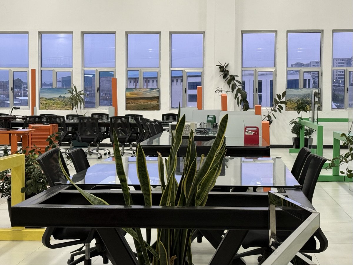 dan ! 

Modern Collaborative Office Hub with Lush Greenery and Vibrant Accents. 

The spirit of Excellence!