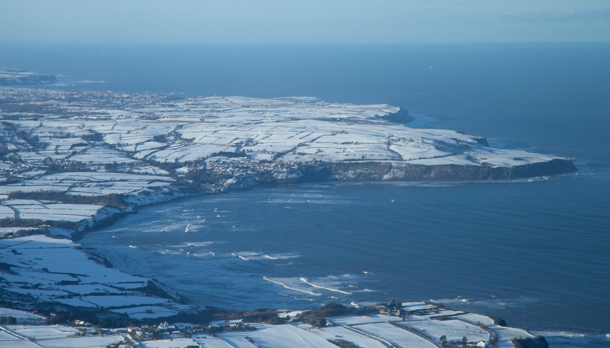 mesheaton's tweet photo. The skies cleared so a flight to the east coast was a must. Here's a snowy Whitby and Robin Hood's Bay. @Hudsonweather https://t.co/OoNfRnmXe3