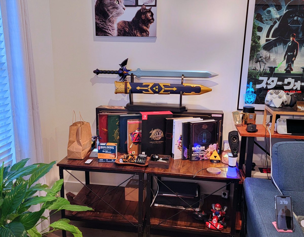 SLE3PR's tweet image. Tried to reorganize the Zelda Monument after we took down the Christmas Tree. Don't know if I like it 🤔 I think the solution will be to get a swiveling reading chair. Maybe that'll really tie the room together.