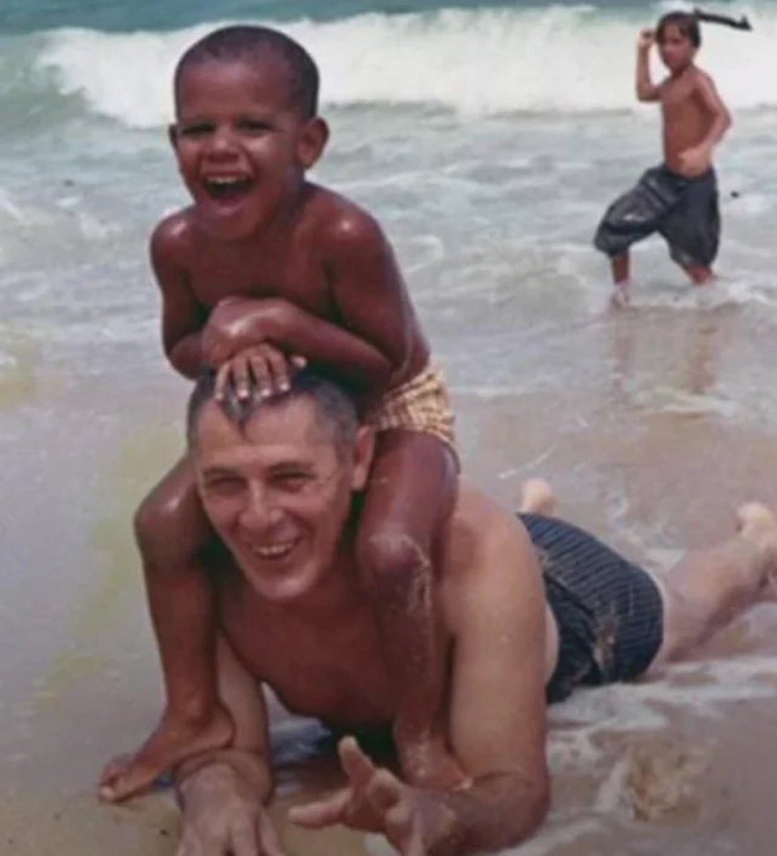 Hoopss's tweet image. A young Barack Obama spending time on the beach with his grandfather, 1963