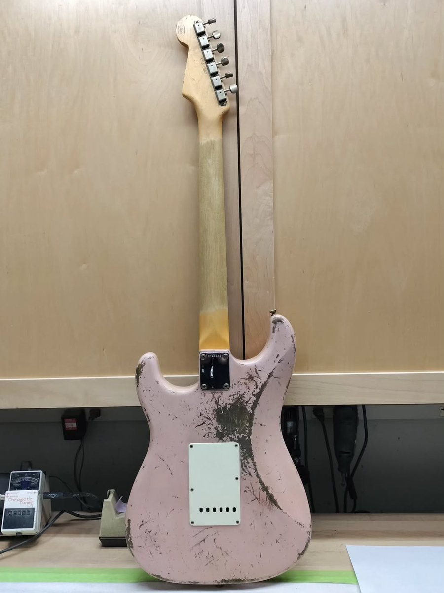 Fender's tweet image. We're loving this '62 Shell Pink Strat with a Brazilian rosewood fretboard Strat from Jason Smith headed to Rainbow Guitars. 🩷