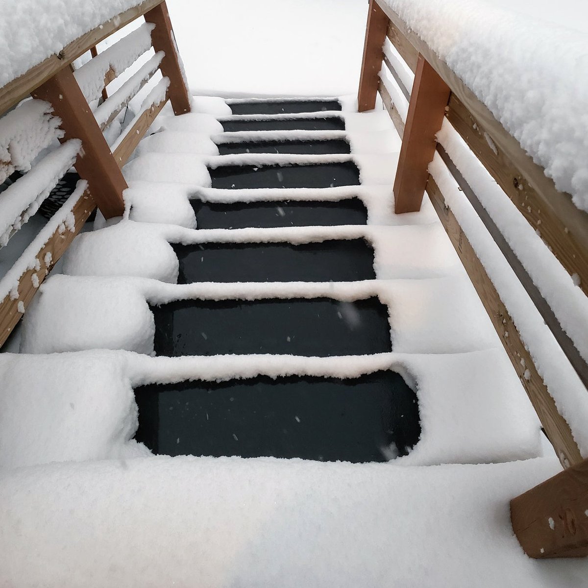 Products's tweet photo. Melt snow on stairs effortlessly with HeatTrak Mats. Stay safe this winter!