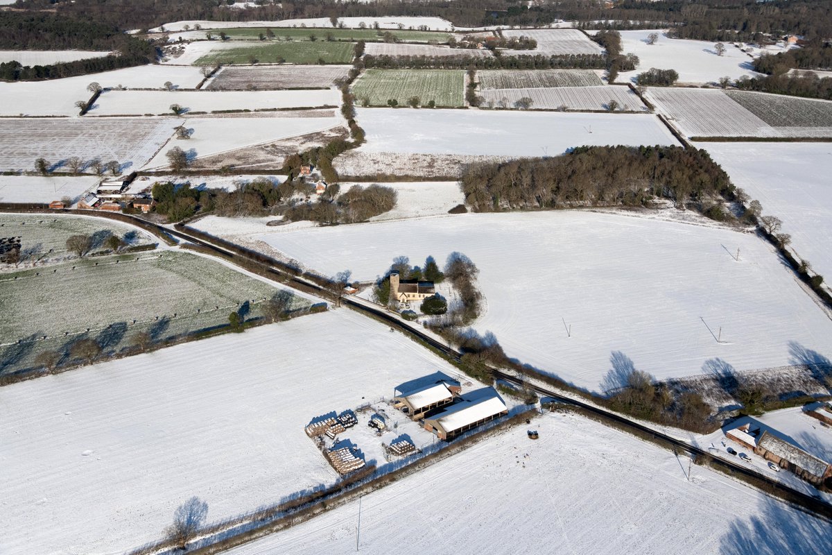 johnfielding001's tweet photo. St Margaret’s Church, Herringfleet, Suffolk. St. Olaves Road passes in front & links the town of St. Olaves to Somerleyton. #Herringfleet #Suffolk #Church #Snow #aerial #image https://t.co/IMG4HoiYA0