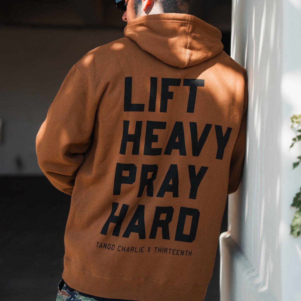 Products's tweet photo. Lift Heavy. Pray Hard. Official Tango Charlie x 13th collab hoodie for strength and faith.