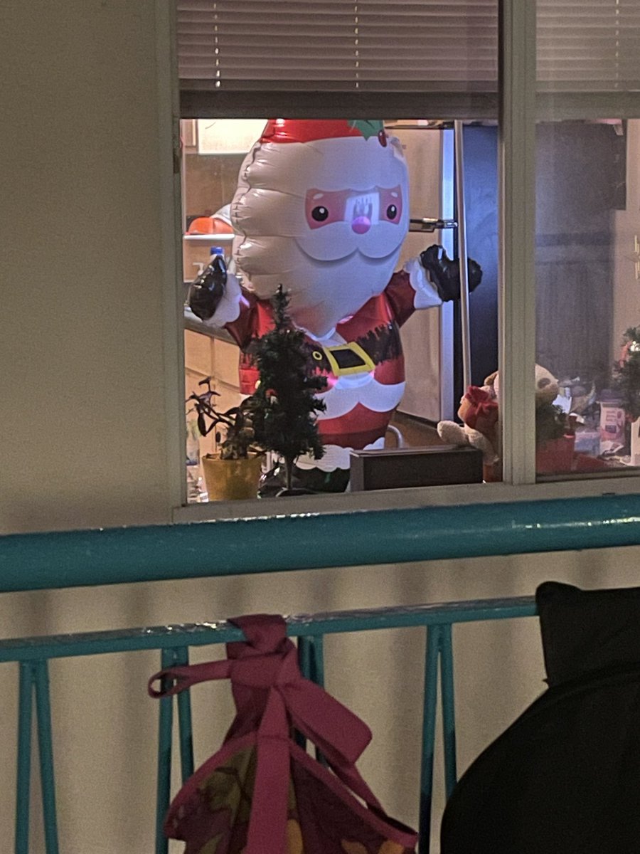 Neighbor has a huge Santa in her window.