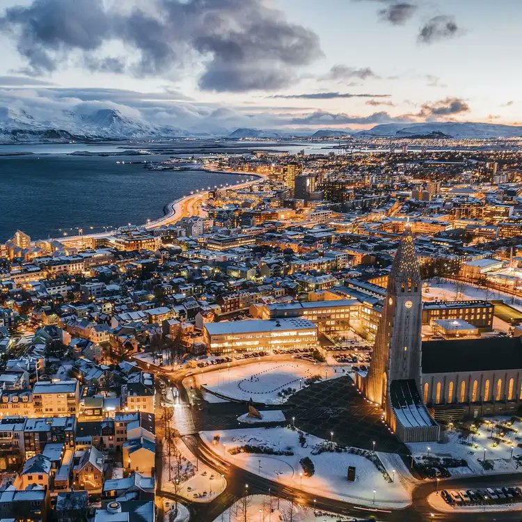 Trip's tweet image. Reykjavík feels like the edge of the world — steam rising from hot springs, snow underfoot, and the sky dancing green above you. Time softens here. Explore more at trip.com/travel-guide/d…