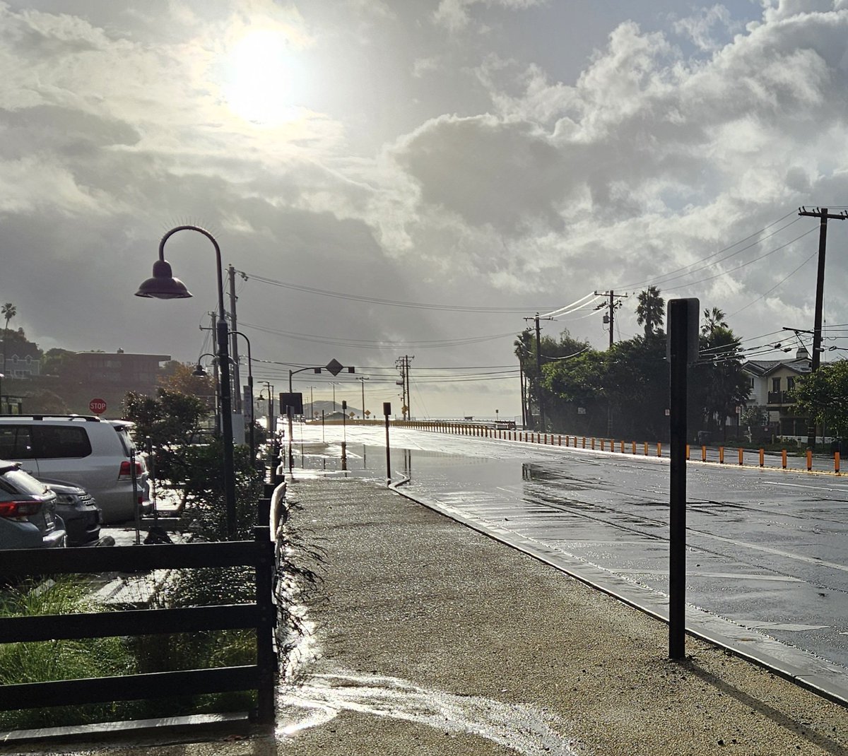 A bit of flooding at the entrance to Trancas Country Mart from PCH in Malibu.  Doesn't look like that much but the water is all the way over the curbs onto the sidewalk and is enough to get over the bottom of car doors on smaller/lower cars.