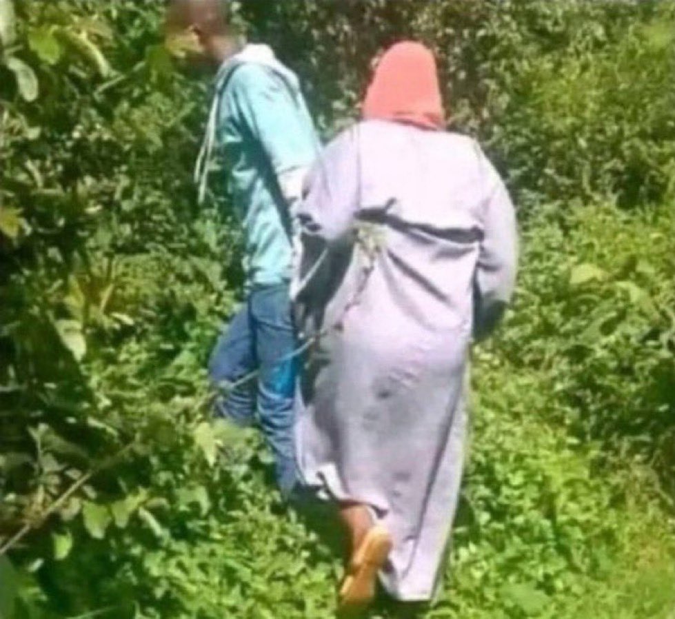 Me in the village taking my cousin to fetch firewood