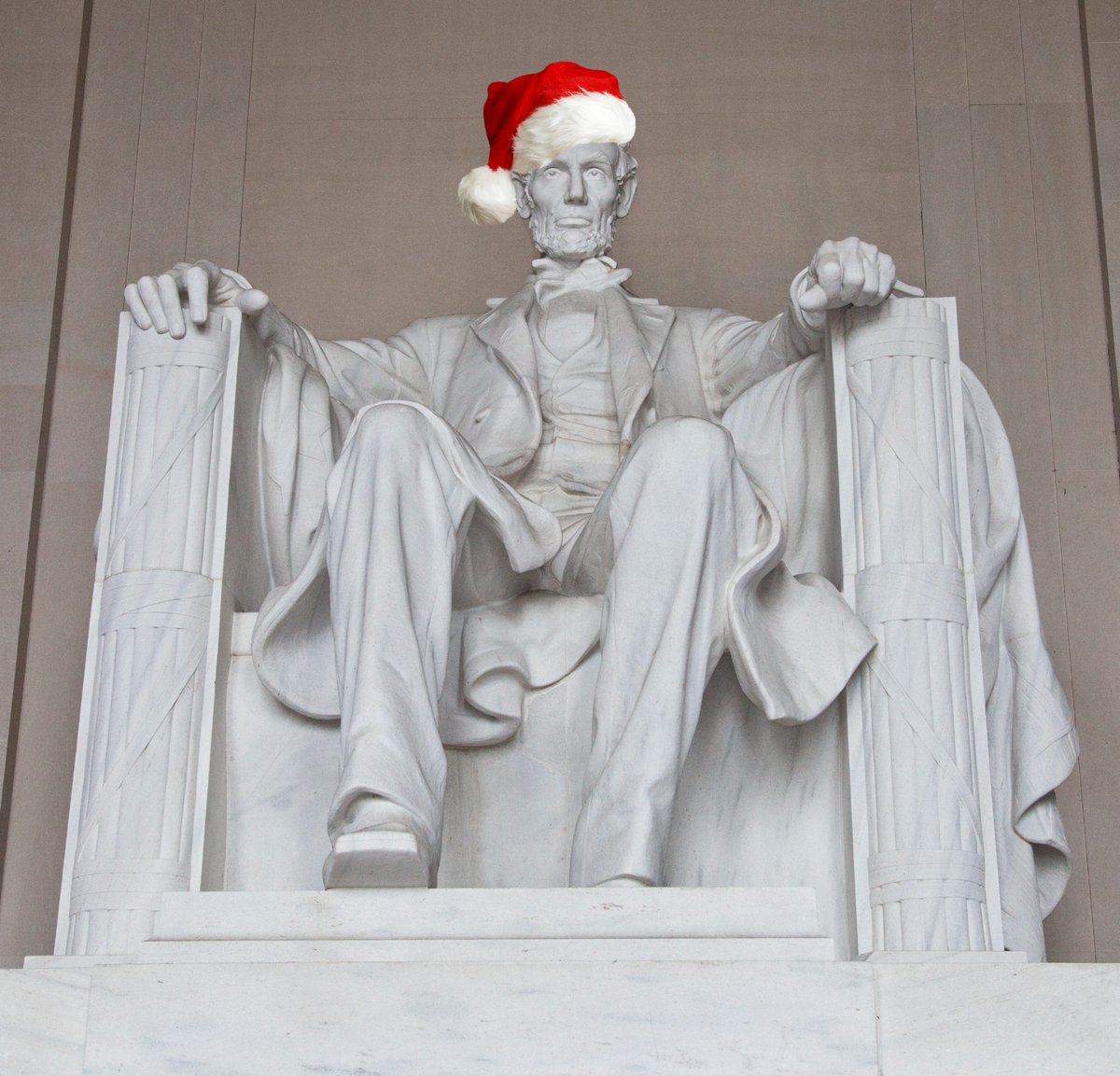 Merry Christmas from our National Mall family to you and yours. 
🎅🎄🎁 
Yes, this is photoshopped. We did not put a Santa hat on the Lincoln statue.