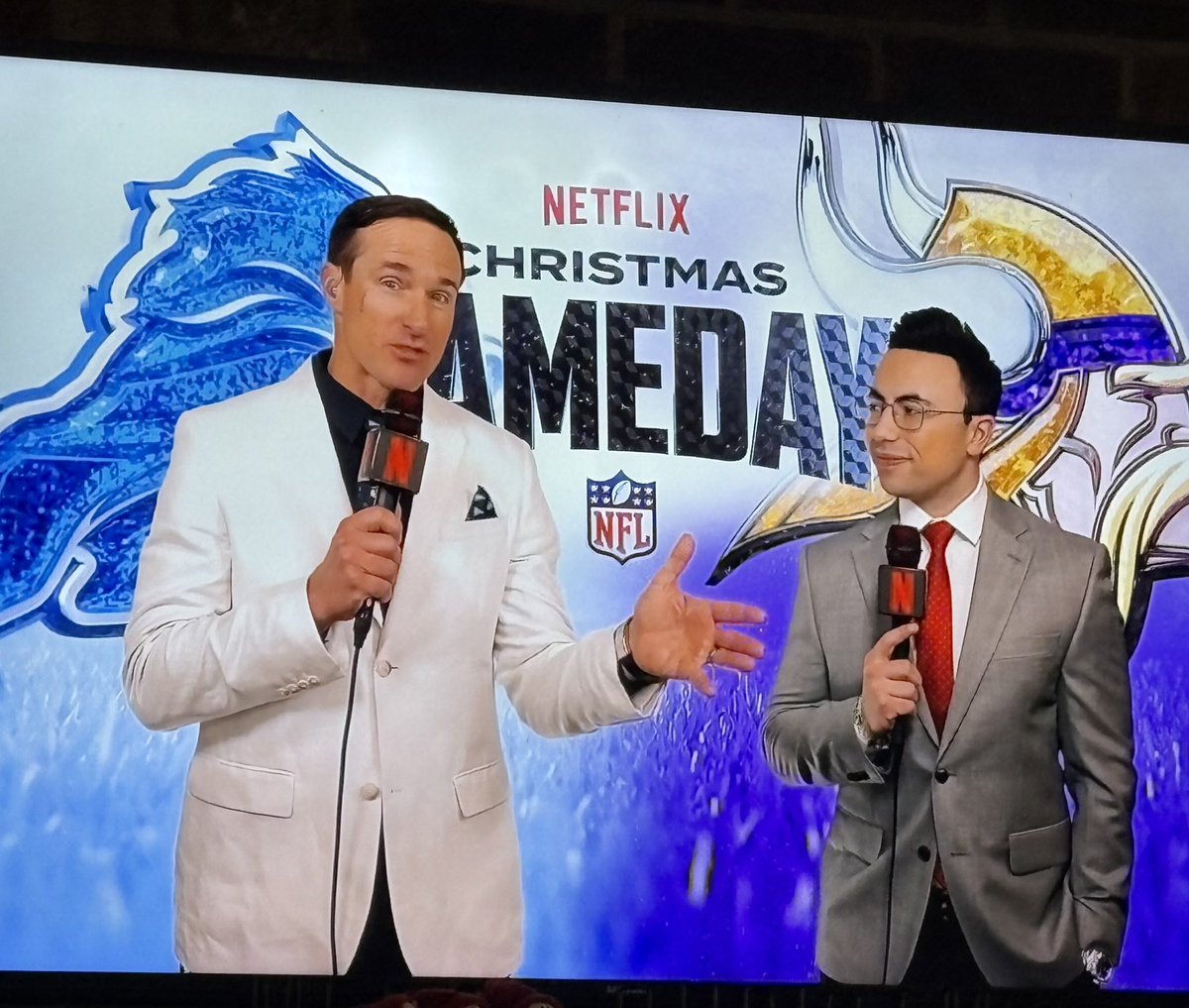 Tennessee_Mojo's tweet image. Drew Brees calling the game with a small child