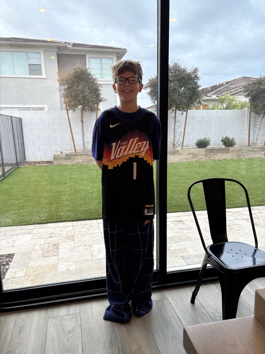 pauljaconelli's tweet photo. Eli rocking his new @DevinBook Valley Jersey he got for Christmas.  Book has been his favorite player his whole life. https://t.co/Qz5nj26gsE