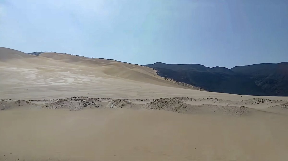 This is Eritrea ! Golden waves of desert dunes against dark mountain  silhouettes – Eritrea's untamed Red Sea frontier @AhmedaniMohamm1 #RedSea # Eritrea, image size:1200x672